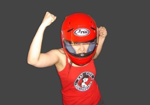 Girl wearing a red tank top and red helmet.